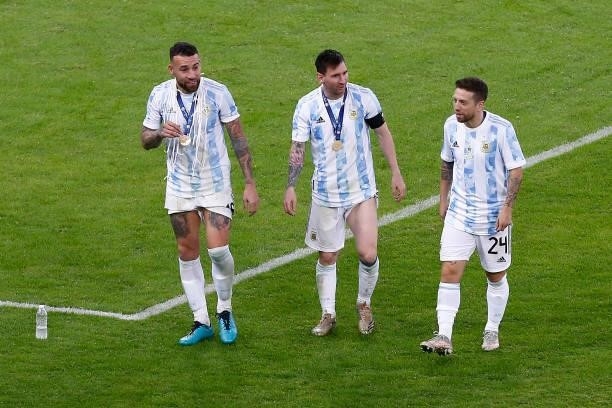 Nicolas Otamendi, Lionel Messi and Alejandro Gomez of Argentina celebrate with their medals after winning the final of Copa America Brazil 2021...