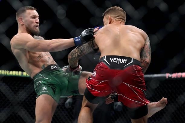 Conor McGregor of Ireland attempts a kick against Dustin Poirier in the first round in their lightweight bout during UFC 264: Poirier v McGregor 3 at...