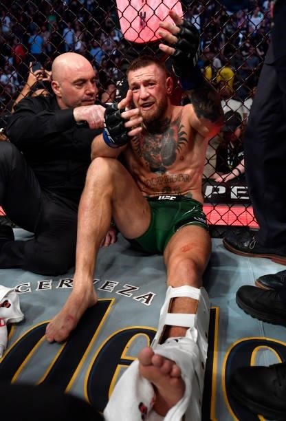 Conor McGregor of Ireland is interviewed by Joe Rogan after his TKO loss due to injury against Dustin Poirier in their welterweight fight during the...