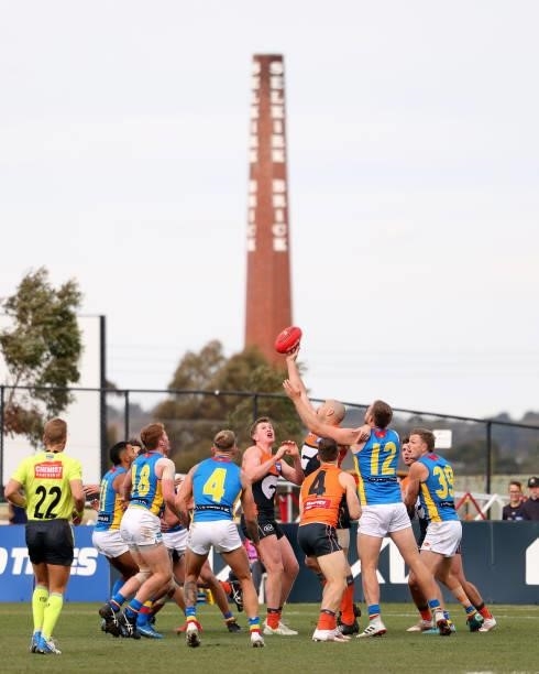 Players contest for the ball during the round 17 AFL match between Greater Western Sydney Giants and Gold Coast Suns at Mars Stadium on July 11, 2021...
