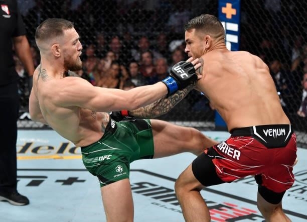 Conor McGregor of Ireland kicks Dustin Poirier in their welterweight fight during the UFC 264 event at T-Mobile Arena on July 10, 2021 in Las Vegas,...