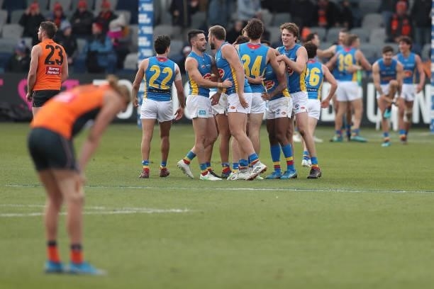 The Suns celebrate victory in the round 17 AFL match between Greater Western Sydney Giants and Gold Coast Suns at Mars Stadium on July 11, 2021 in...