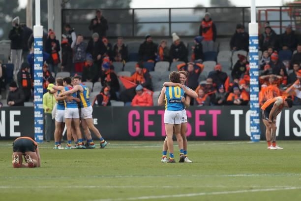 The Suns celebrate victory in the round 17 AFL match between Greater Western Sydney Giants and Gold Coast Suns at Mars Stadium on July 11, 2021 in...