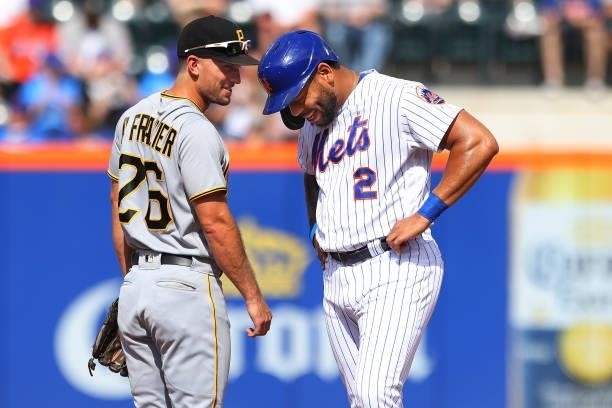 Dominic Smith of the New York Mets talks with Adam Frazier of the Pittsburgh Pirates during game one of a double header at Citi Field on July 10,...