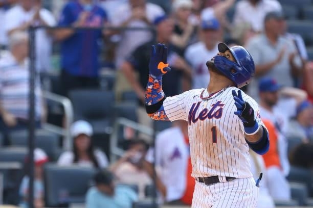 Jonathan Villar of the New York Mets gestures after he hit a home run during the fourth inning against the Pittsburgh Pirates during game one of a...