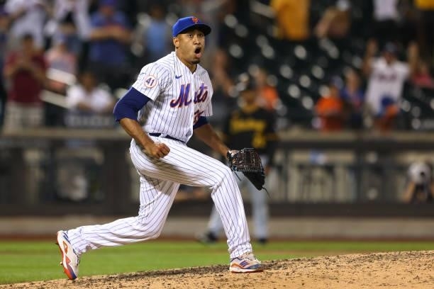 Closer Edwin Diaz of the New York Mets reacts after striking out the side in the ninth inning against the Pittsburgh Pirates during the second game...