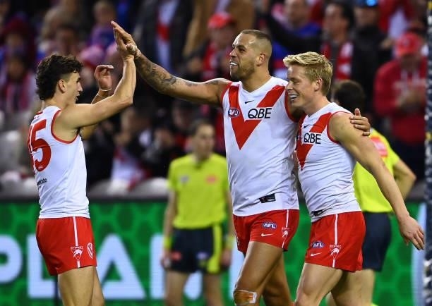 Lance Franklin of the Swans is congratulated by team mates after kicking a goal during the round 17 AFL match between Western Bulldogs and Sydney...