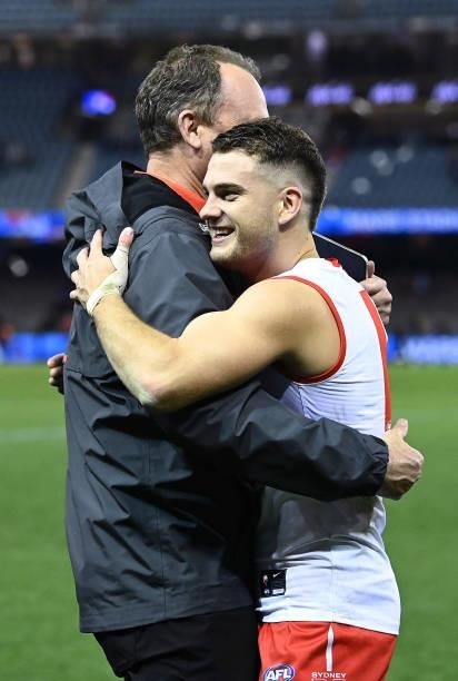 Swans head coach John Longmire hugs Tom Papley of the Swans after winning the round 17 AFL match between Western Bulldogs and Sydney Swans at Marvel...