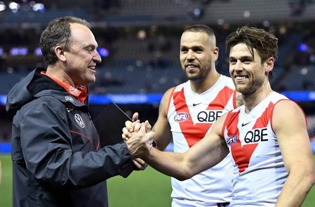 Swans head coach John Longmire and Dane Rampe of the Swans celebrate winning the round 17 AFL match between Western Bulldogs and Sydney Swans at...