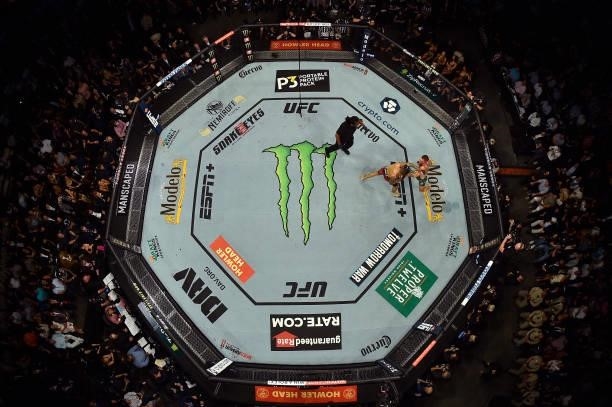 An overhead view of the Octagon as Conor McGregor of Ireland and Dustin Poirier exchange punches during the UFC 264 event at T-Mobile Arena on July...