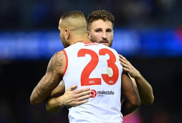 Lance Franklin of the Swans and Marcus Bontempelli of the Bulldogs hug at the end of the match during the round 17 AFL match between Western Bulldogs...