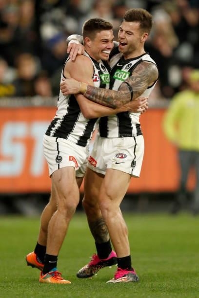 Josh Thomas and Jamie Elliott of the Magpies celebrates a goal during the round 17 AFL match between Richmond Tigers and Collingwood Magpies at...