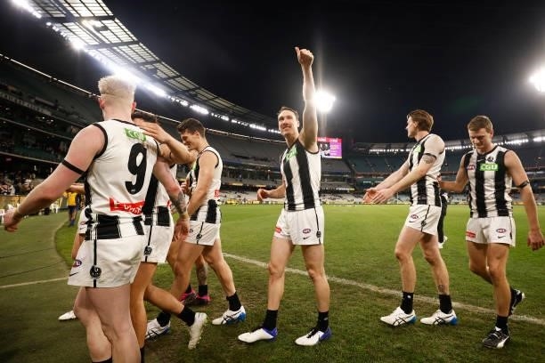 Jack Madgen of the Magpies gestures to the crowd as the Magpies celebrate victory during the round 17 AFL match between Richmond Tigers and...