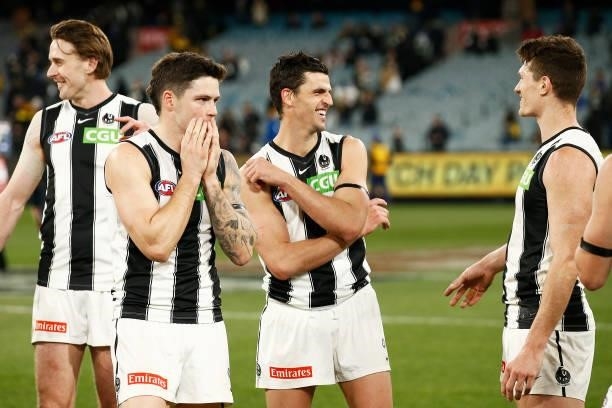 Scott Pendlebury of the Magpies and the Magpies celebrate victory during the round 17 AFL match between Richmond Tigers and Collingwood Magpies at...