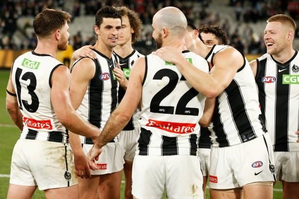 Scott Pendlebury of the Magpies celebrates with teammates after victory in the round 17 AFL match between Richmond Tigers and Collingwood Magpies at...