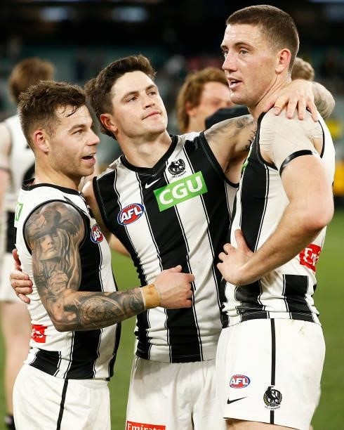 Jamie Elliott, Jack Crisp and Darcy Cameron of the Magpies celebrate victory in the round 17 AFL match between Richmond Tigers and Collingwood...