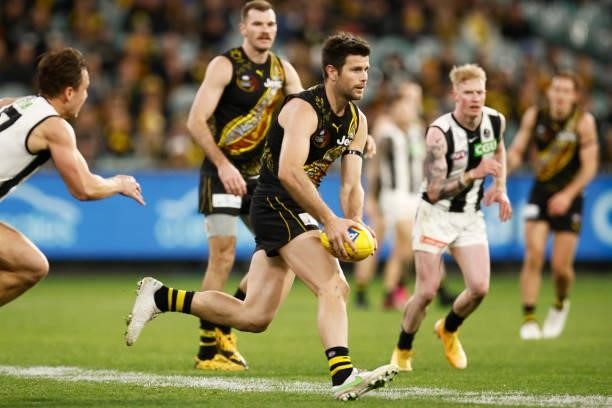 Trent Cotchin of the Tigers runs with the ball during the round 17 AFL match between Richmond Tigers and Collingwood Magpies at Melbourne Cricket...