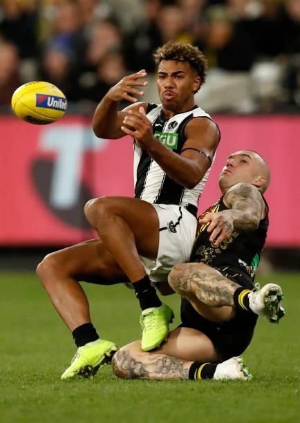 Dustin Martin of the Tigers and Issac Quaynor of the Magpies compete during the round 17 AFL match between Richmond Tigers and Collingwood Magpies at...