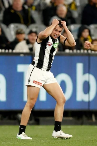 Trent Bianco of the Magpies reacts after missing a goal during the round 17 AFL match between Richmond Tigers and Collingwood Magpies at Melbourne...
