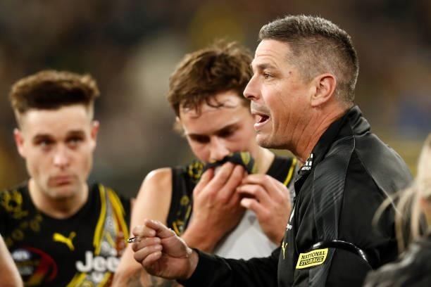 Richmond assistant coach Adam Kingsley speaks with players at the 3/4 time huddle during the round 17 AFL match between Richmond Tigers and...