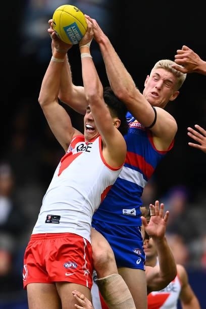 Justin McInerney of the Swans and Tim English of the Bulldogs compete for a mark during the round 17 AFL match between Western Bulldogs and Sydney...