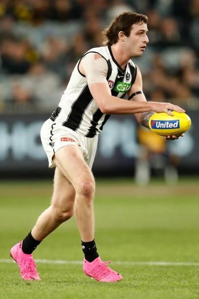 Trey Ruscoe of the Magpies runs with the ball during the round 17 AFL match between Richmond Tigers and Collingwood Magpies at Melbourne Cricket...