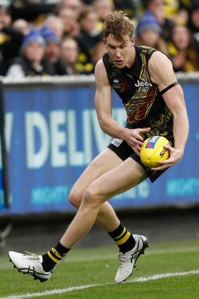Tom J. Lynch of the Tigers gathers the ball during the round 17 AFL match between Richmond Tigers and Collingwood Magpies at Melbourne Cricket Ground...