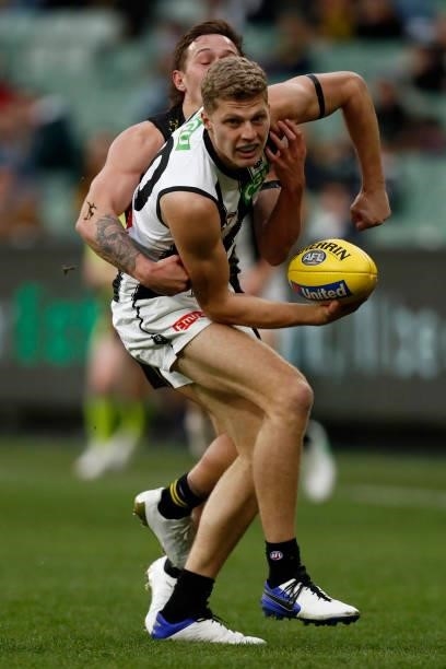 Will Kelly of there Magpies is tackled during the round 17 AFL match between Richmond Tigers and Collingwood Magpies at Melbourne Cricket Ground on...