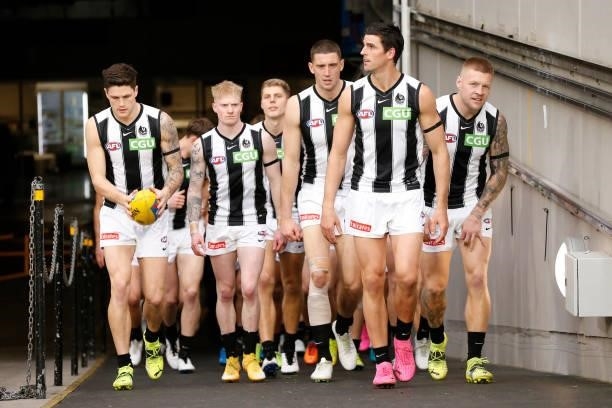 Collingwood players run out before the round 17 AFL match between Richmond Tigers and Collingwood Magpies at Melbourne Cricket Ground on July 11,...