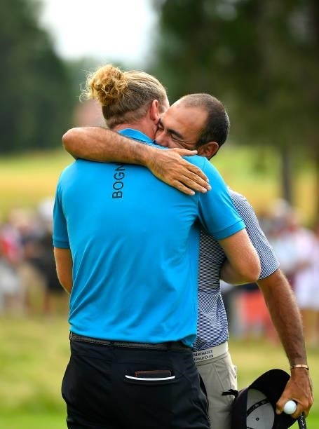 Marcel Siem of Germany embraces his caddie following victory in the Le Vaudreuil Golf Challenge at Golf PGA France du Vaudreuil on July 11, 2021 in...