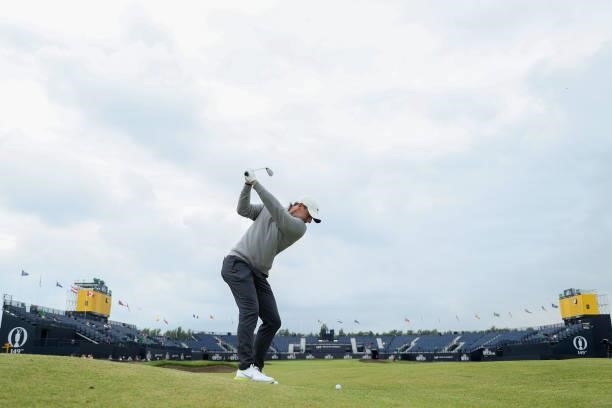 Rory McIlroy of Northern Ireland plays a shot on the eighteenth green during a practice round for The 149th Open at Royal St George’s Golf Club on...