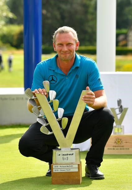 Marcel Siem of Germany celebrate with the trophy following victory in the Le Vaudreuil Golf Challenge at Golf PGA France du Vaudreuil on July 11,...