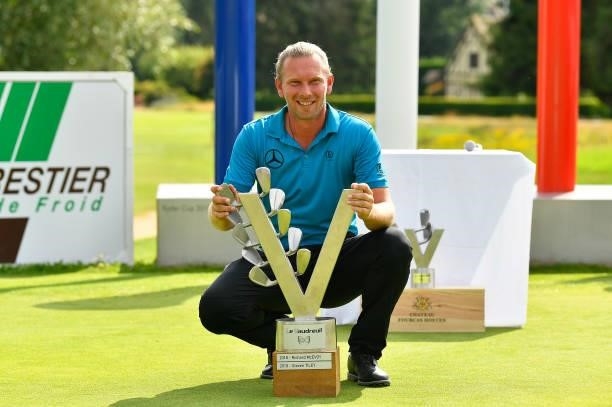 Marcel Siem of Germany celebrate with the trophy following victory in the Le Vaudreuil Golf Challenge at Golf PGA France du Vaudreuil on July 11,...