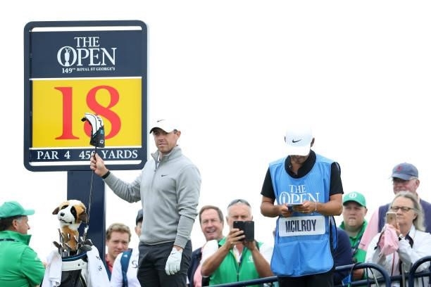 Rory McIlroy of Northern Ireland selects a club during a practice round for The 149th Open at Royal St George’s Golf Club on July 11, 2021 in...