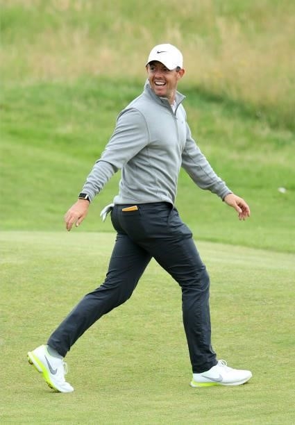 Rory McIlroy of Northern Ireland laughs on course during a practice round prior for The 149th Open at Royal St George’s Golf Club on July 11, 2021 in...