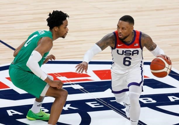 Damian Lillard of the United States brings the ball up the court against KZ Okpala of Nigeria during an exhibition game at Michelob ULTRA Arena ahead...