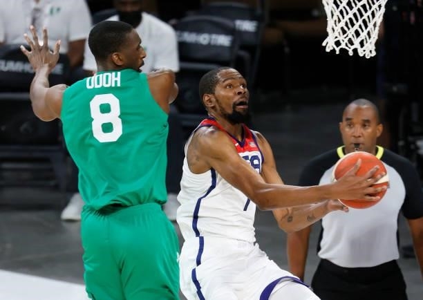 Kevin Durant of the United States drives to the basket against Ekpe Udoh of Nigeria during an exhibition game at Michelob ULTRA Arena ahead of the...