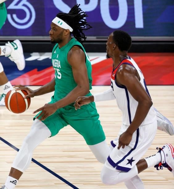 Precious Achiuwa of Nigeria brings the ball up the court against Bam Adebayo of the United States during an exhibition game at Michelob ULTRA Arena...