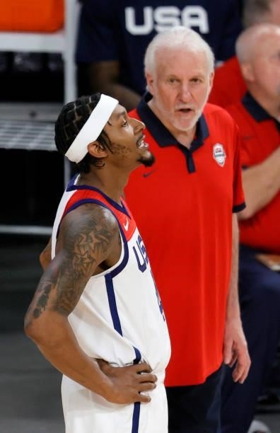 Bradley Beal of the United States talks with head coach Gregg Popovich during an exhibition game against Nigeria at Michelob ULTRA Arena ahead of the...