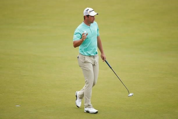 Lucas Herbert of Australia reacts to the crowd after his putt on the 18th green during Day Four of the abrdn Scottish Open at The Renaissance Club on...