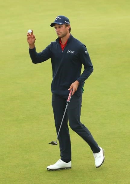 Thomas Detry of Belgium reacts to the crowd after his putt on the 18th green during Day Four of the abrdn Scottish Open at The Renaissance Club on...
