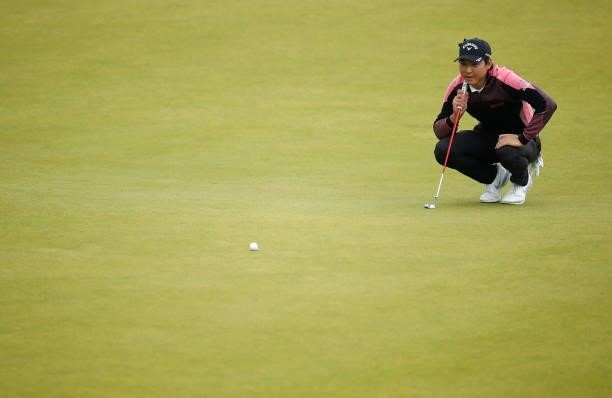 Min Woo Lee of Australia lines up his putt on the18th green during Day Four of the abrdn Scottish Open at The Renaissance Club on July 11, 2021 in...