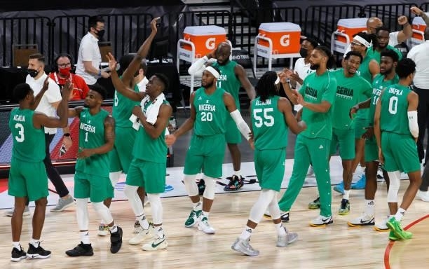 Nigeria players celebrate after their 90-87 victory over the United States in an exhibition game at Michelob ULTRA Arena ahead of the Tokyo Olympic...