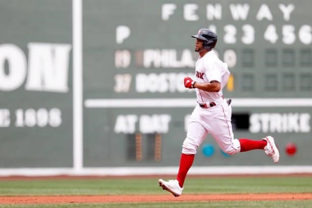 Xander Bogaerts of the Boston Red Sox rounds the bases after hitting a home run against the Philadelphia Phillies during the second inning at Fenway...