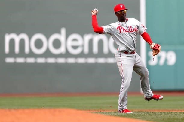 Didi Gregorius of the Philadelphia Phillies throws to first to force out Marwin Gonzalez of the Boston Red Sox during the second inning at Fenway...