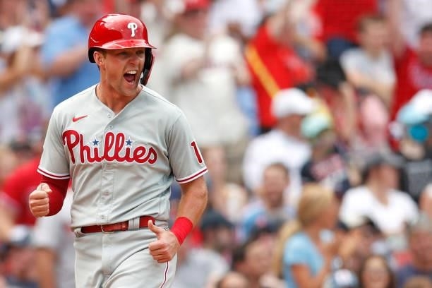 Rhys Hoskins of the Philadelphia Phillies celebrates running towards home after Ronald Torreyes hit a three run home run against the Boston Red Sox...
