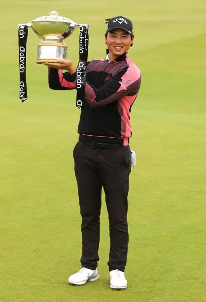 Min Woo Lee of Australia celebrates with the trophy after winning the abrdn Scottish Open at The Renaissance Club on July 11, 2021 in North Berwick,...