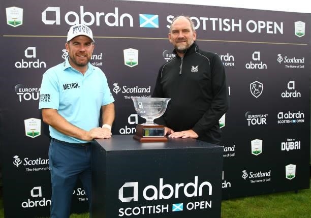 Richie Ramsay of Scotland winner of the the Jock MacVicar AGW Memorial Award poses with Martin Dempster chairman of thre AGW during Day Four of the...