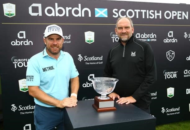 Richie Ramsay of Scotland winner of the the Jock MacVicar AGW Memorial Award poses with Martin Dempster chairman of thre AGW during Day Four of the...
