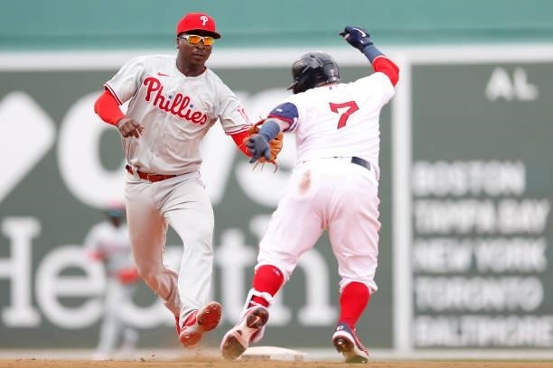Didi Gregorius of the Philadelphia Phillies tags out Christian Vazquez of the Boston Red Sox during the sixth inning at Fenway Park on July 11, 2021...